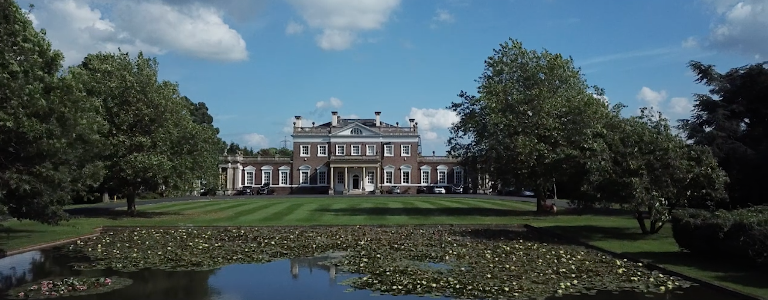 Aerial views of Boreham House and the mirrored lake