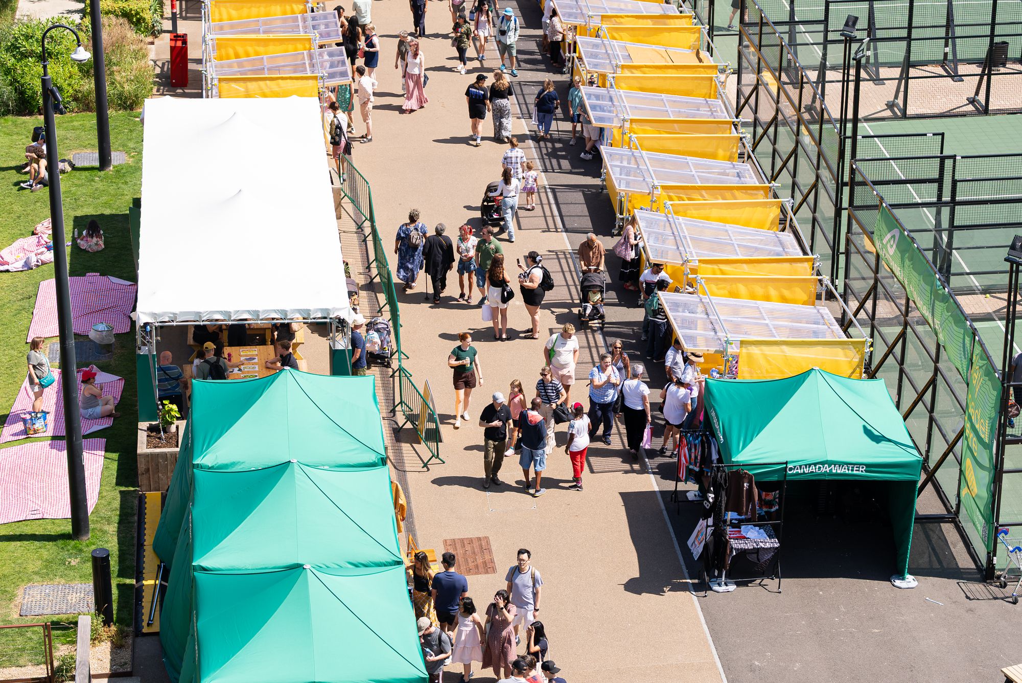 Looking down on the Craft & Flea stalls and shoppers along the Canada Water dockside.
