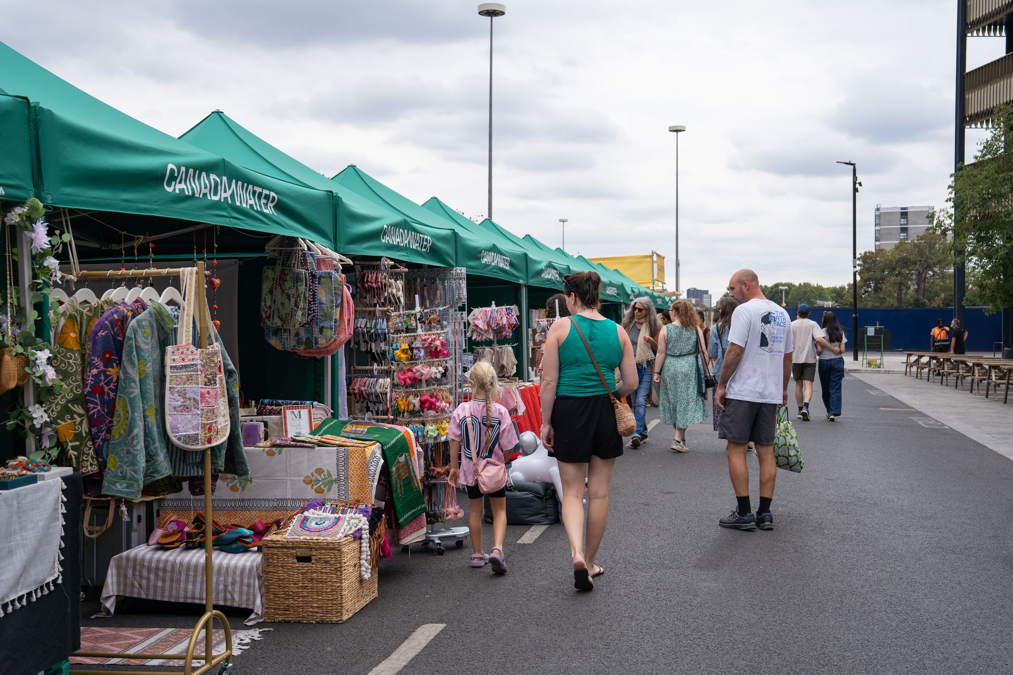 The line of Craft & Flea stalls along the dockside road at Canada Water, London.