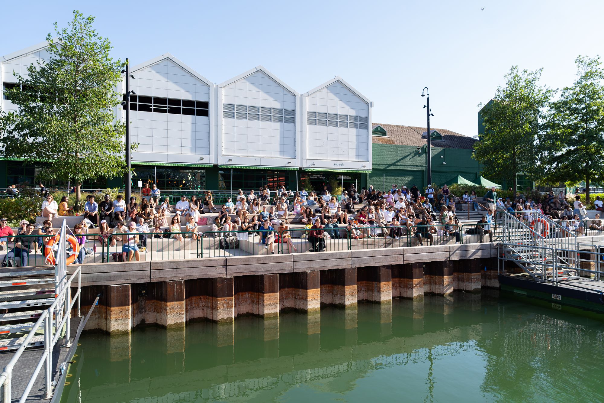 A wide view across Canada Dock to the crowd on the dockside steps during Round the Dock.