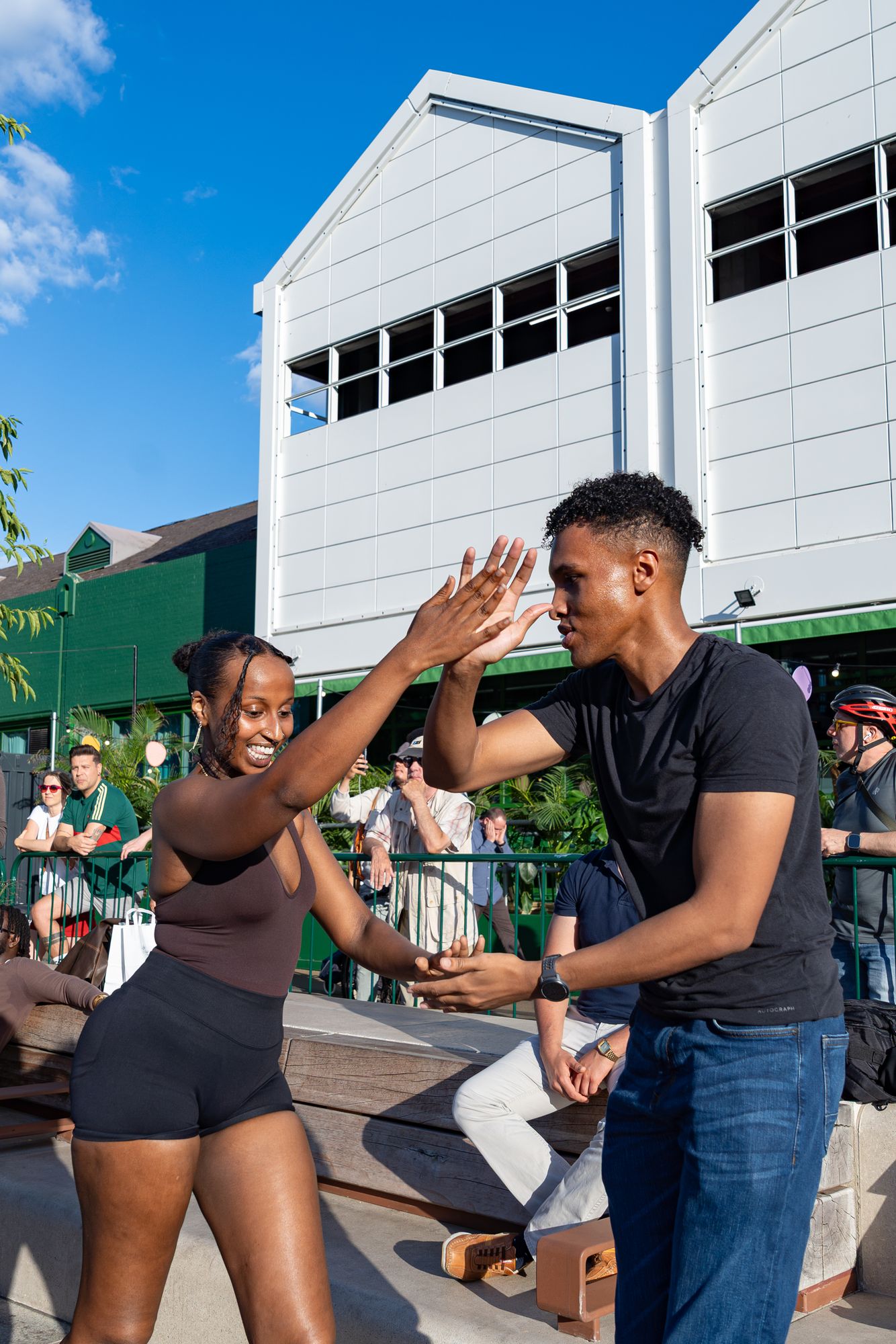 A couple dancing salsa on the Canada Water dockside during Round the Dock's salsa evening.
