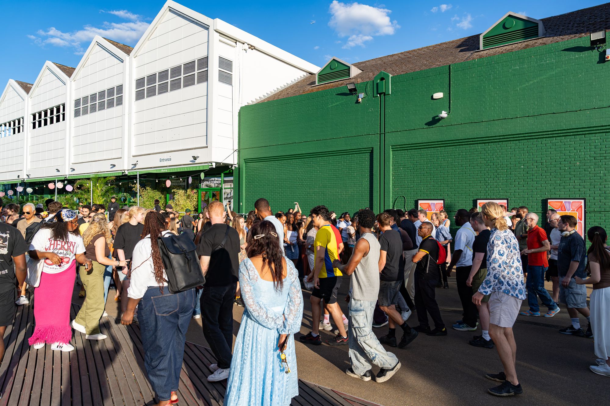 A crowd joining a group salsa class on the dockside at Round the Dock, Canada Water, London.