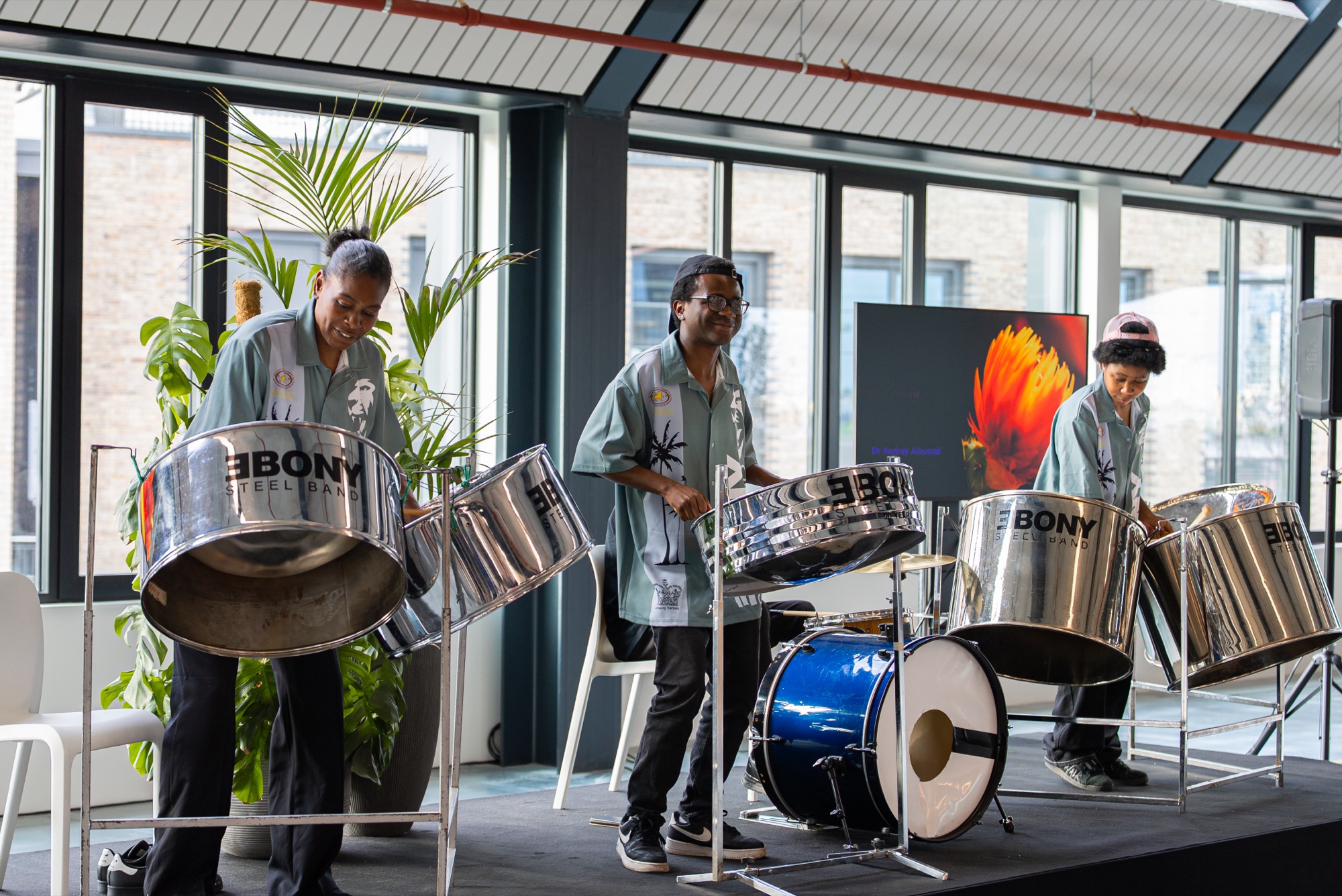 A steelpan band performing inside the Dock Shed at the Windrush celebration, Canada Water, London SE16.
