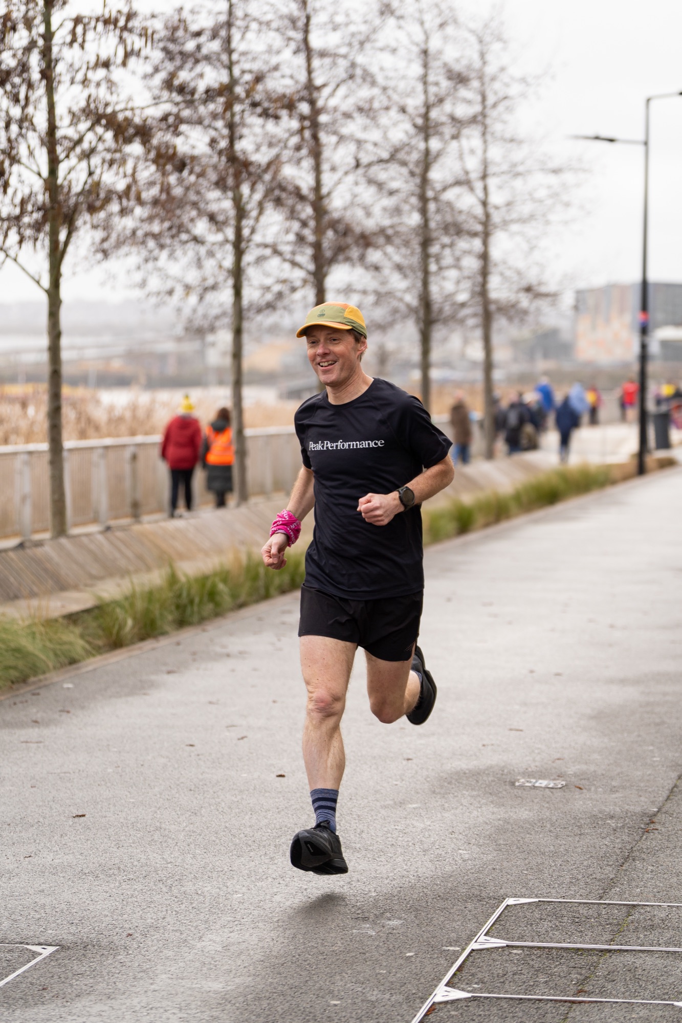 Community event coverage at Greenwich Peninsula Parkrun — participants on the waterfront course