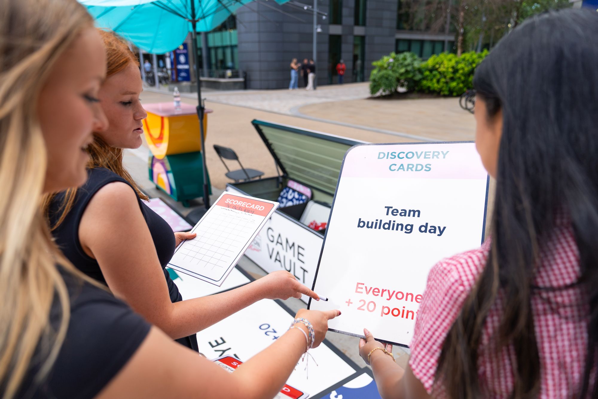 Players reading a 'Team building day' Discovery Card during a Lifesize London game at Paddington Central.