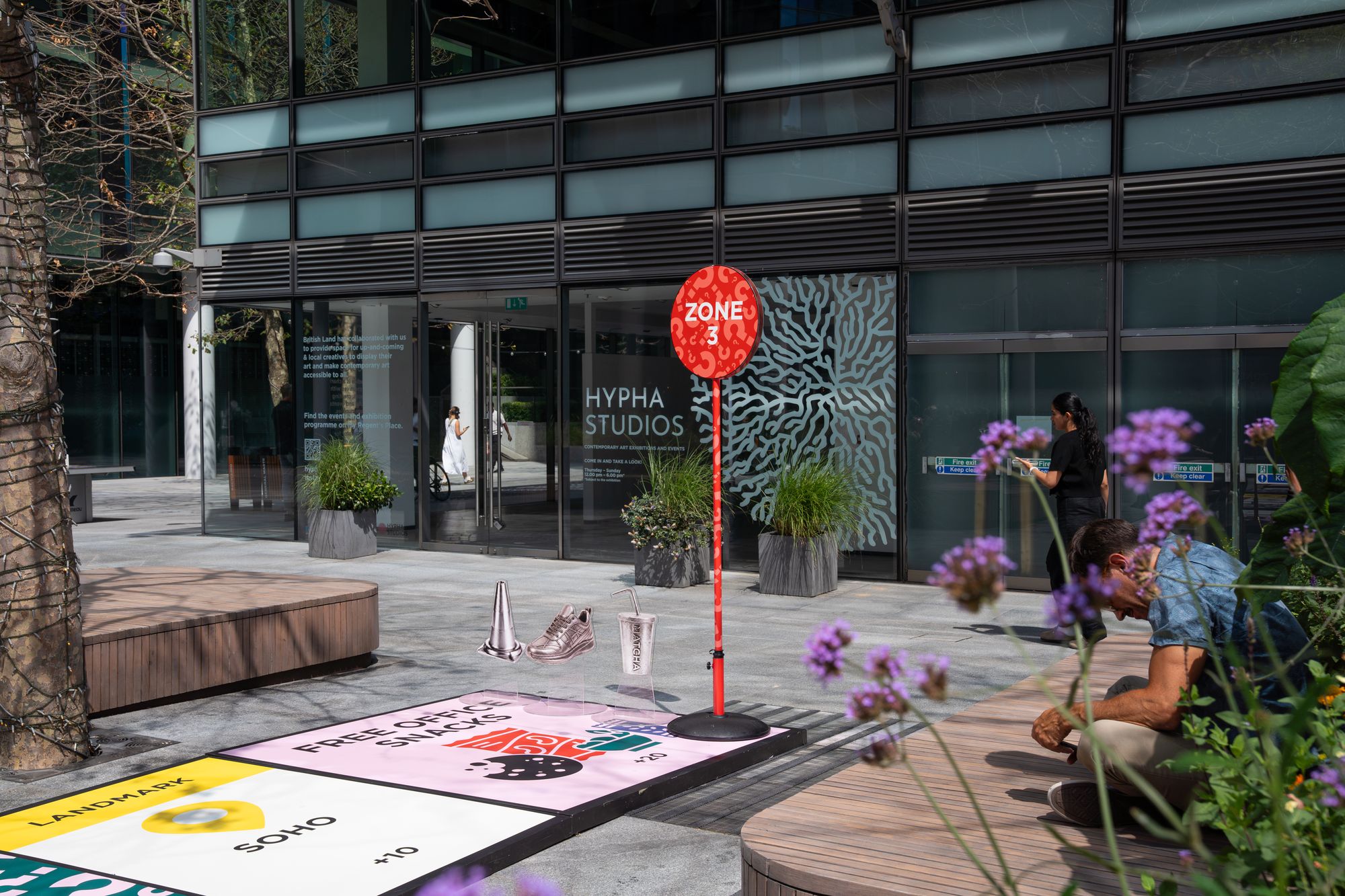 A zone marker and landmark squares on the Lifesize London board outside Hypha Studios, Regent's Place.