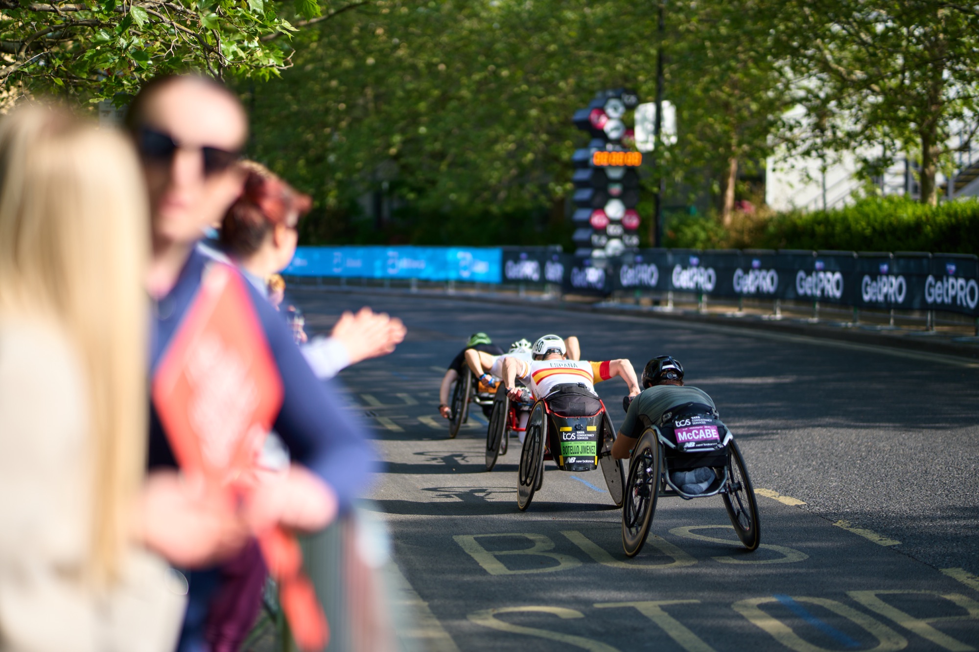 Event photography at the London Marathon 2026 — runners at the Canada Water water station